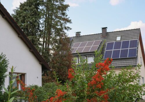 Photo of a house with solar panels on the roof