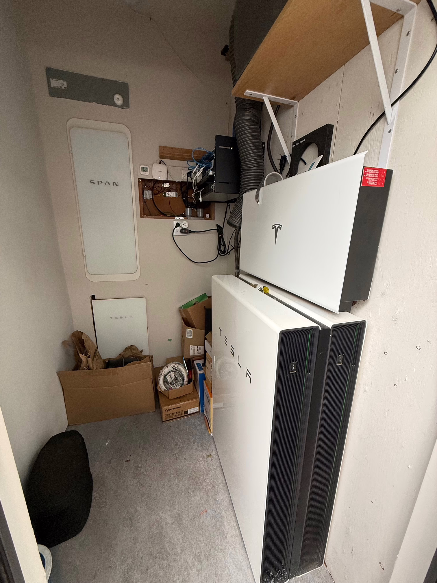 Hawley Main house Battery wall_electric panel Photo of home storage batteries and electrical panel